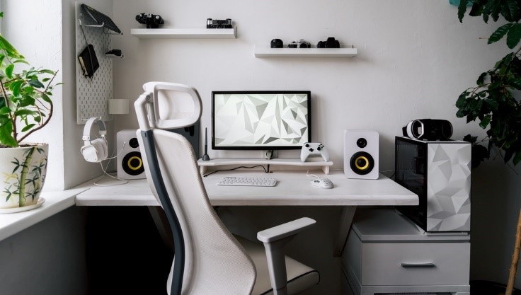 white office space with chair and desk and computer all white