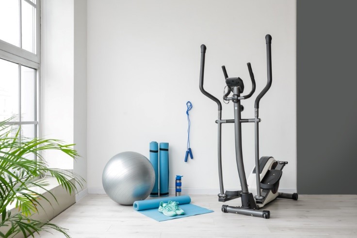 workout equipment in room that is neat and clean