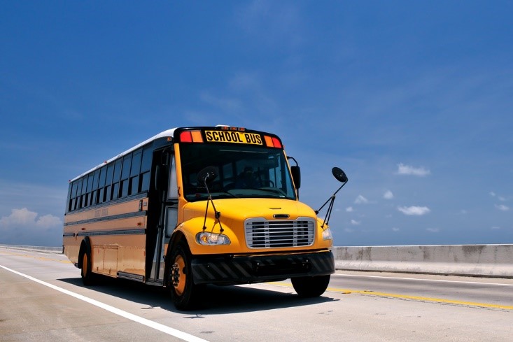yellow school bus driving